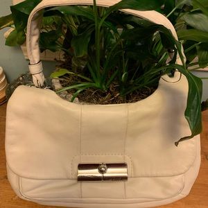 Beautiful Kristin Coach bag.  It is clean no rubs and the unique clasp